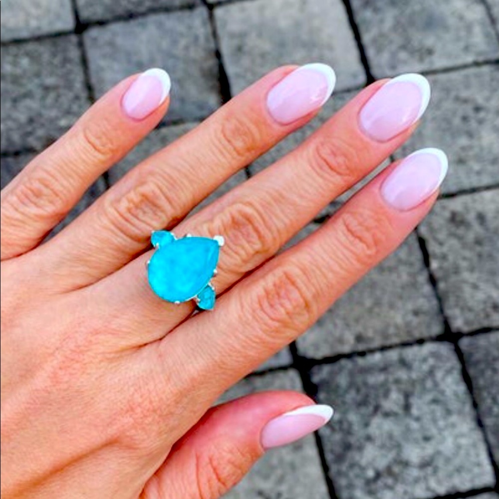 Gorgeous paraiba tourmaline ring.  Size 9 hand crafted. Like new condition.